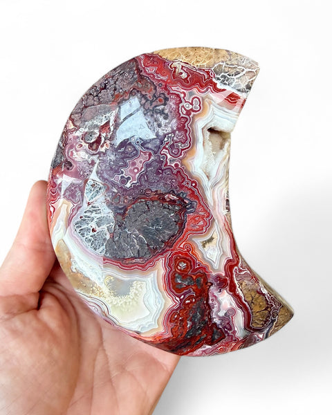 Mexican agate crystal moon carving on stand