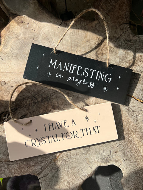 I have a crystal for that - hanging wooden sign