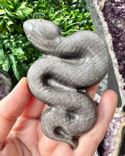 Silver sheen obsidian snake carving