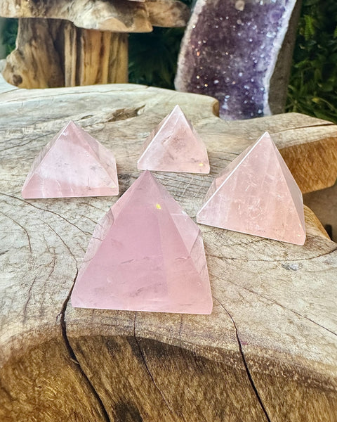 Rose quartz pyramid carving