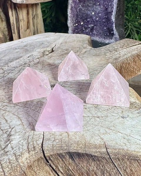 Rose quartz pyramid carving