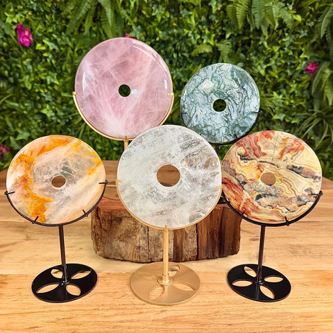 Collection on bi disc crystal carvings on stand