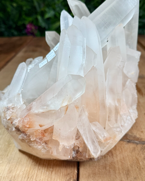 Clear quartz cluster with hematite inclusions