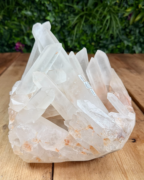 Clear quartz cluster with hematite inclusions