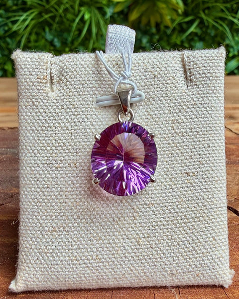 Faceted amethyst pendant in sterling silver - rounded oval cut