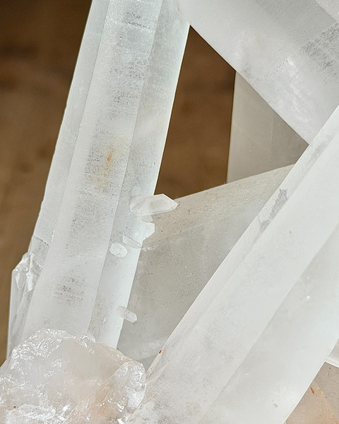 Clear quartz cluster with hematite inclusions