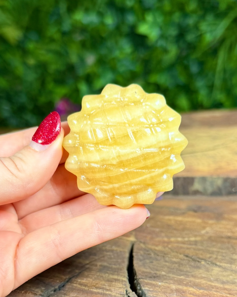 Orange calcite sunflower carving