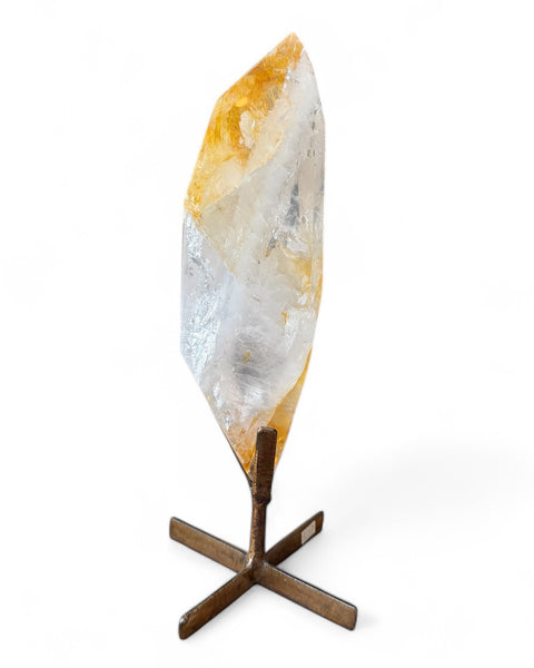 Golden healer quartz crystal on stand