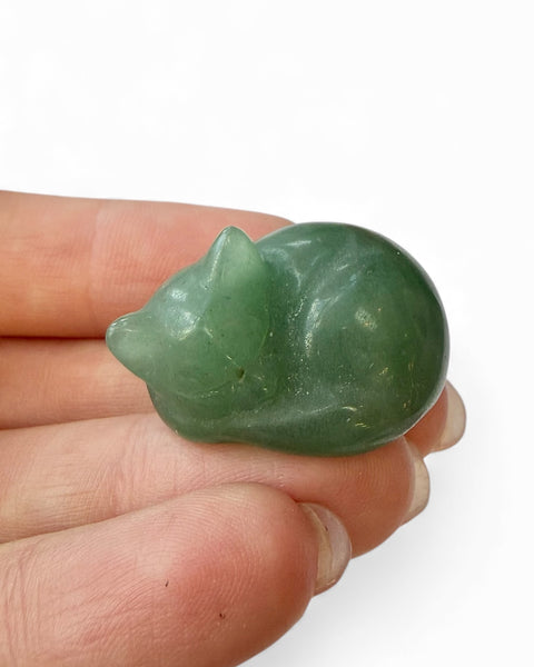 Mini curled up sleeping cat carving