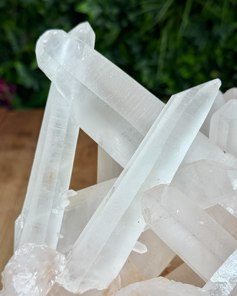 Clear quartz cluster with hematite inclusions
