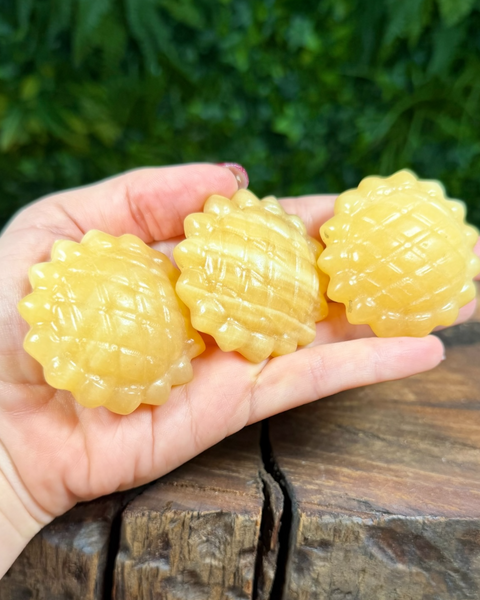 Orange calcite sunflower carving