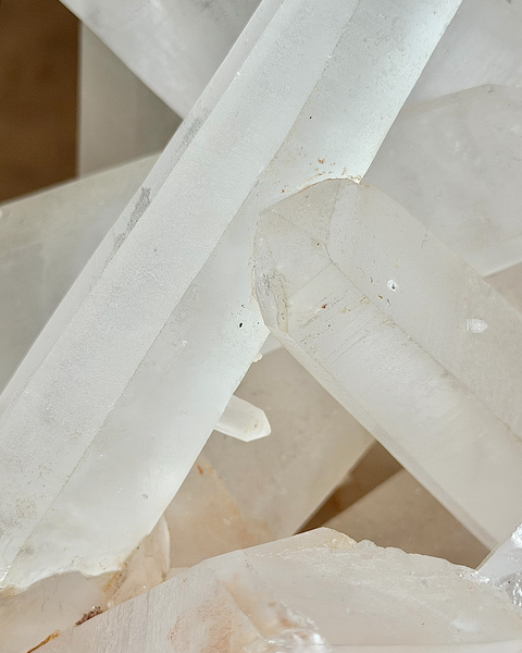Clear quartz cluster with hematite inclusions