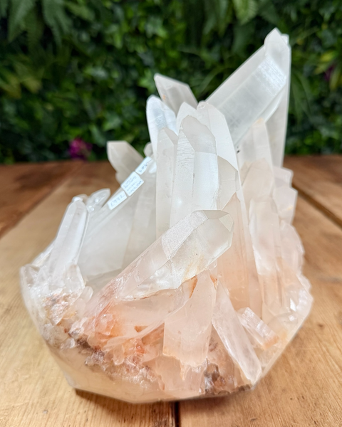 Clear quartz cluster with hematite inclusions