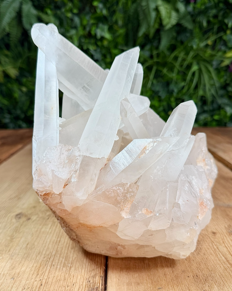 Clear quartz cluster with hematite inclusions