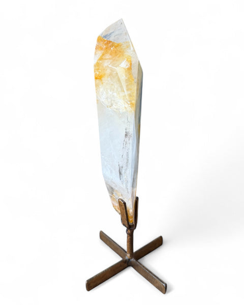 Golden healer quartz crystal on stand