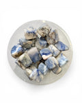 A bowl of afghanite tumble stones