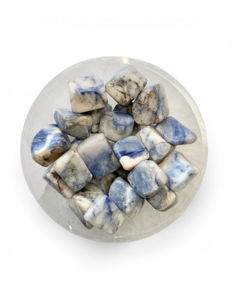 A bowl of afghanite tumble stones