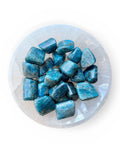 a bowl of blue apatite tumble stones