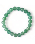 A green beaded bracelet made of aventurine stones, displayed on a white background.