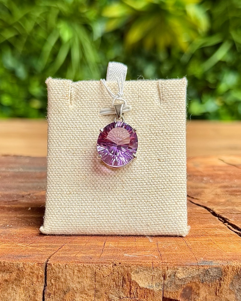 Faceted amethyst pendant in sterling silver - rounded oval cut