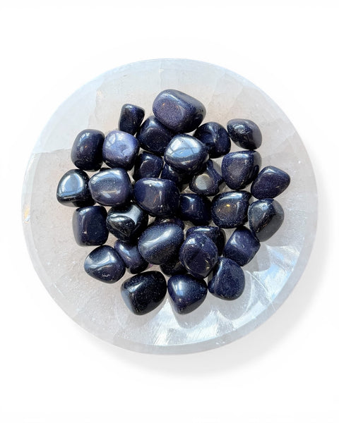 Blue gold stone tumble stones in a bowl