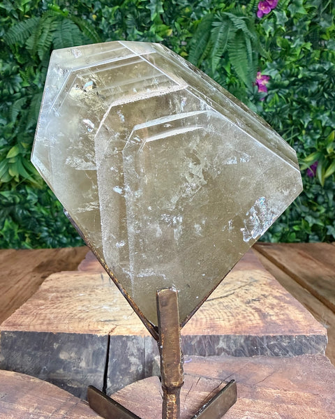 Faceted citrine on stand with lodalite phantom