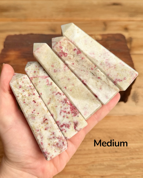 Hand holding cinnabrite towers