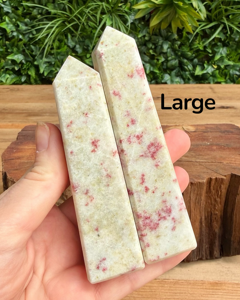 hand holding large cinnabrite crystal towers