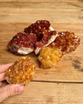 citrine crystal clusters on a table