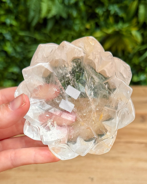 clear quartz lotus shaped dish held in hand