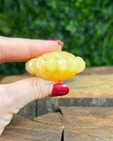 Orange calcite sunflower carving
