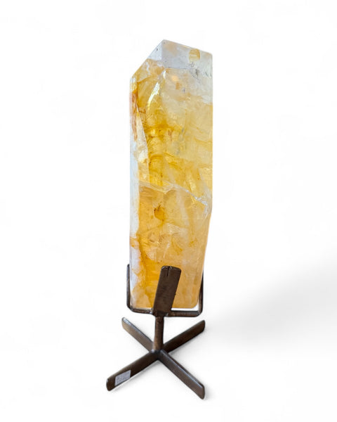 Golden healer quartz crystal on stand