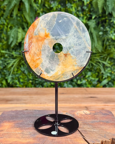 Golden healer quartz doughnut carving on stand