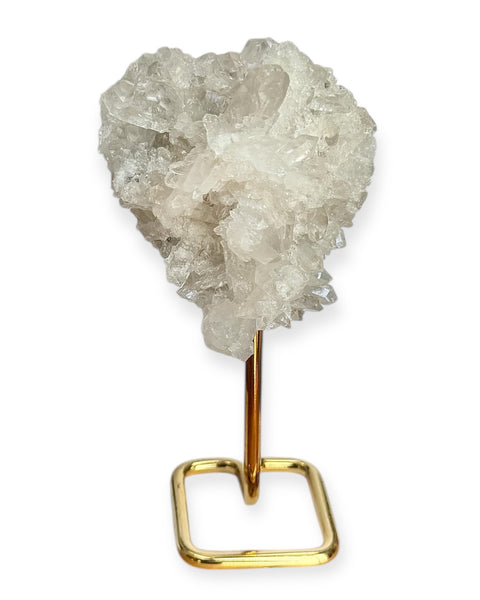 Clear quartz cluster on gold stand