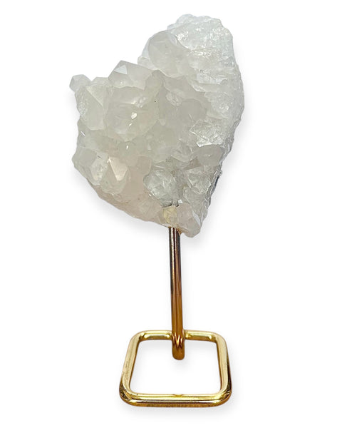 Clear quartz cluster on gold stand