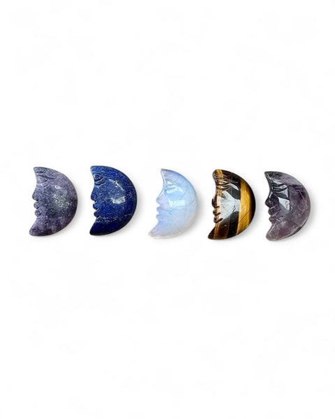 Moon with face carving
