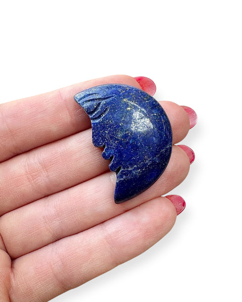Moon with face carving