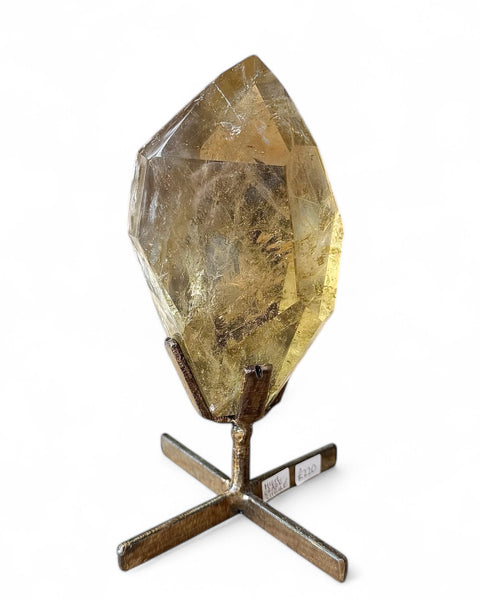Natural faceted citrine on stand front view