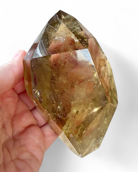 Natural citrine held in hand