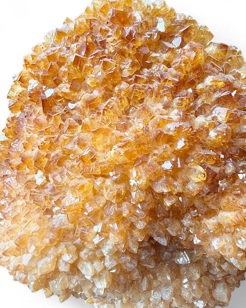 Heat treated citrine crystal on stand