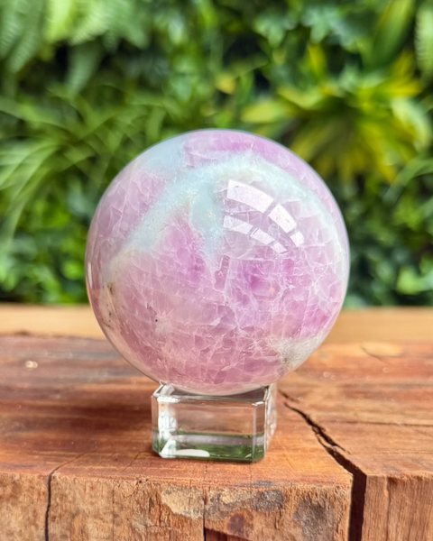 lilac crystall kunzite sphere on a stand