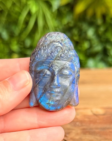 Buddha head carving made out of labradorite crystal