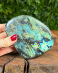 Labradorite freeform crystal glowing with multicolour light