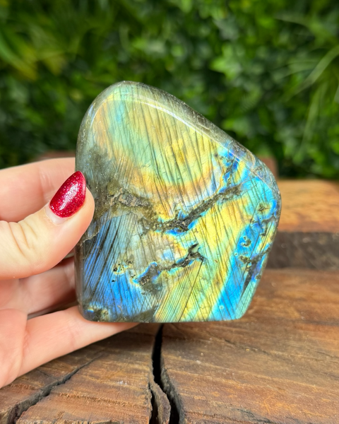 Labradorite freeform stone displaying green, blue and gold flashes