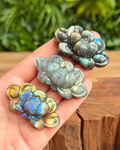 labradorite lotus flower carvings in hand