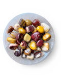A bowl of mookaite tumble stones