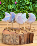 A collection of moonstone moons on stand
