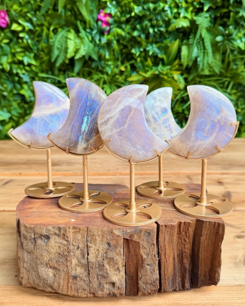A collection of moonstone moons on stand