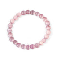 A pink  cats eye beaded crystal  bracelet with a stretch cord, featuring 8mm round beads.