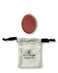 Goldstone crystal thumb worry stone with a Feel Good Crystals drawstring pouch